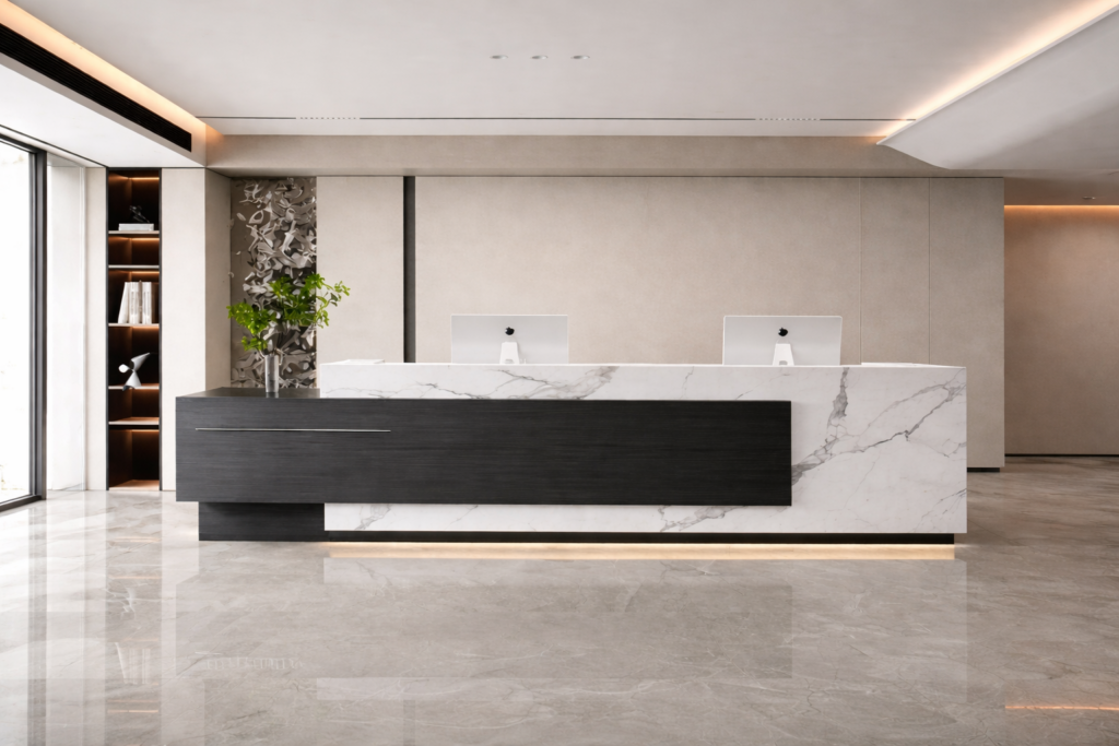 Premium stone and metal finishes in modern commercial office reception India